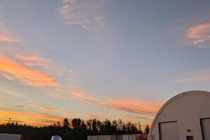 The BVEX radio telescope observing the crescent Moon during sunrise on the morning of August 12th, 2025.
