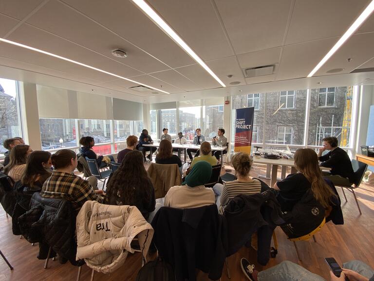 A captive audience listens to the Shift Podcast Live Recording panel on Male Allyship.