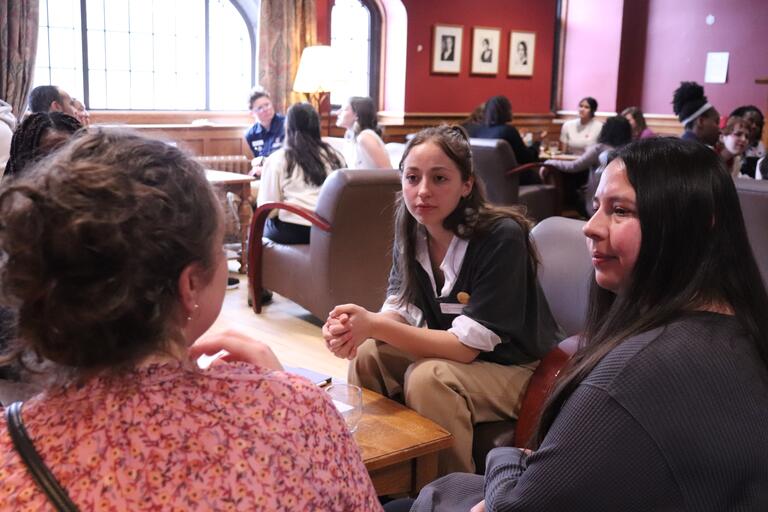 Students and staff converse at the Conversation Cafe.