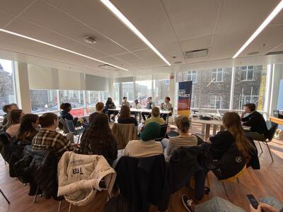 audience watches live panel