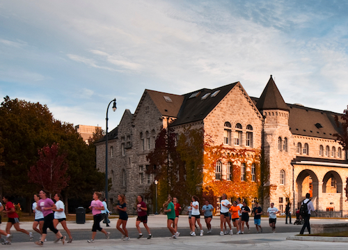 Image - Running in the fall on Queen's campus. Image courtesy of the Queen's Image Bank.