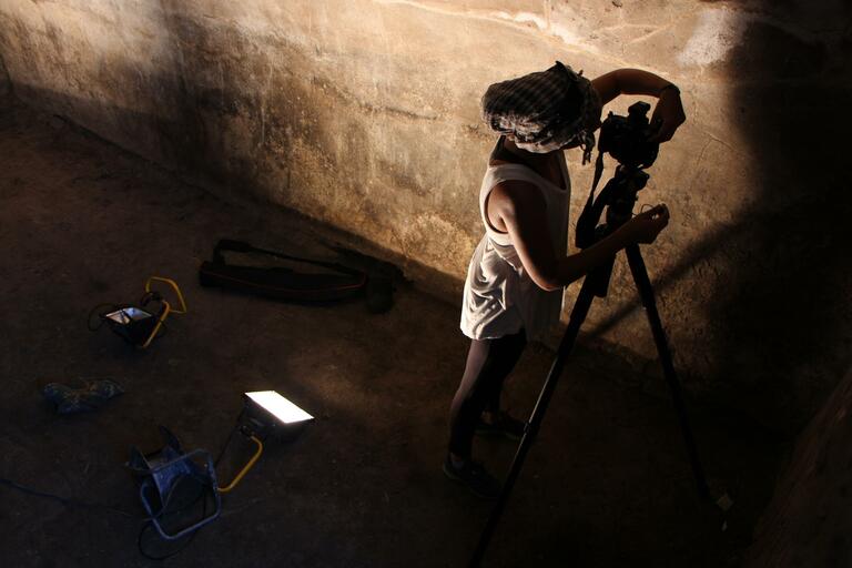 Student setting up to take photographs of an underground chamber at Stobi excavation site. 