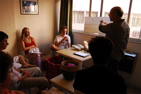 Students attending a class on how to clean bones during Humayma excavation field study.