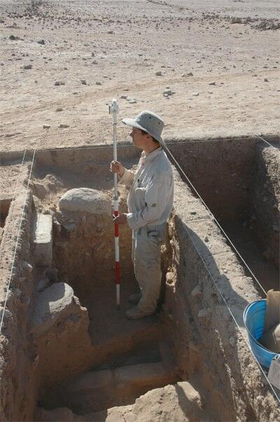 Student taking elevation measurements at Humayma.