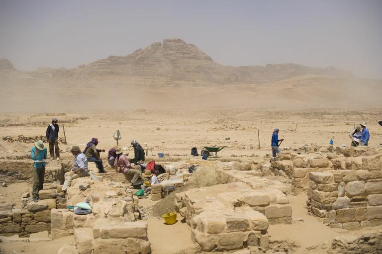 Photograph of students and locals working at Humayma excavation site.