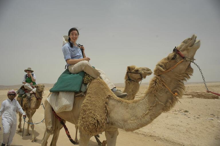 Students riding on camels in Jordan.