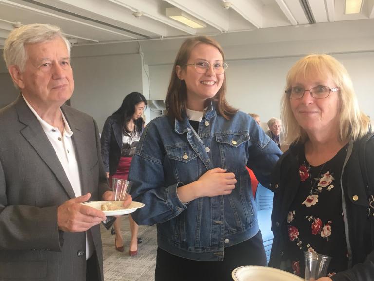 A graduate and their family having food