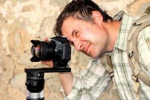 Photograph of Dr. Bevan taking a photo of the Stobi excavation site.