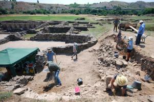 Students working on Stobi site, with tent set up for storing finds.