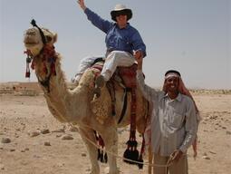 Dr. Reeves on camel back in Jordan.