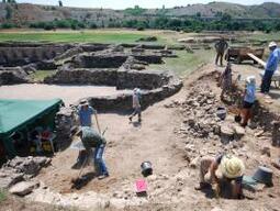 Students working on Stobi site, with tent set up for storing finds.