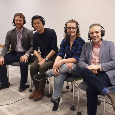 Four people with headsets on