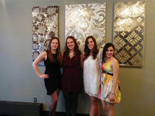 Four students at a fancy event