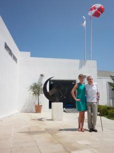 Two people standing outside of a museum