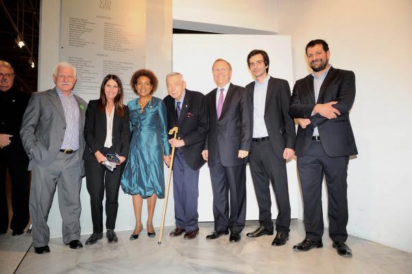 Seven people smiling