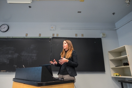 A person standing behind a podium talking