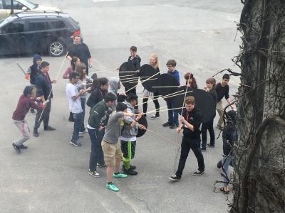 People simulating a battle in a parking lot