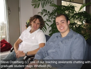 Two teaching assistants sitting in chairs