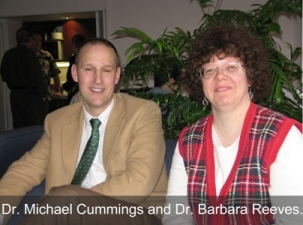 Two faculty members smiling