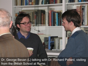 Two people smiling while having a conversation