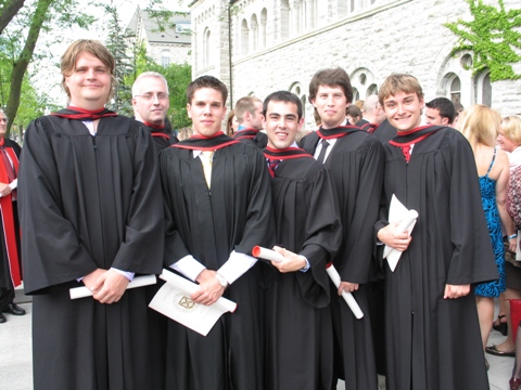 Six students outside of Grant Hall smiling