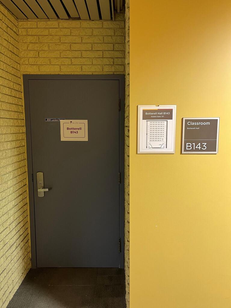 The first of two doors to enter Botterell B143. The door is equipped with a metal handle on the left side. The door cannot be controlled by an automatic door opener.