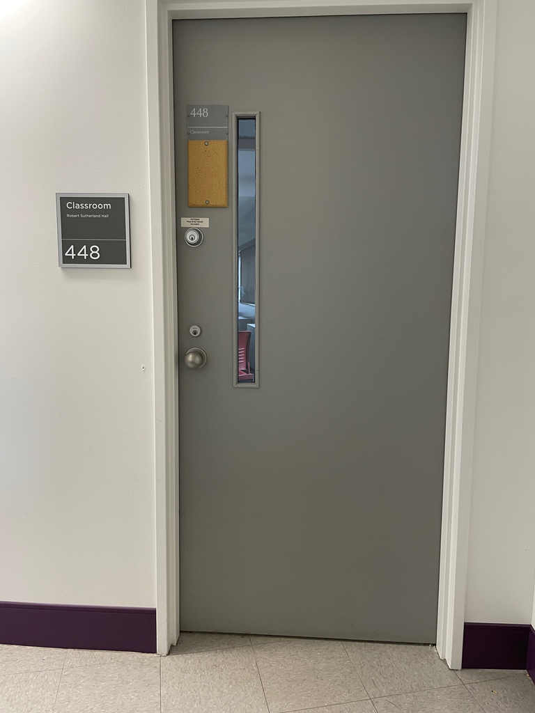 The door is grey and has a knob on the left side. 