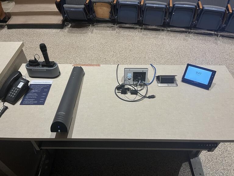 The podium is height adjustable and comes equipped with lecture capture, a document camera as well as a set of microphones.