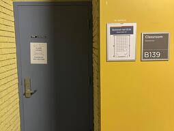 Entryway to Botterell Hall Room B139. There are two entrances with single doors, opened by a handle. This door is not automatic.