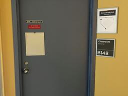 Door to enter Botterell Hall B148. The door has a knob on the left side, and does not have automatic control.
