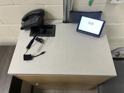 Top down view of the podium. Podium is not height adjustable, and is equipped with a document camera, lecture capture and a set of microphones.