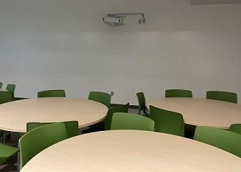 round tables with green chairs