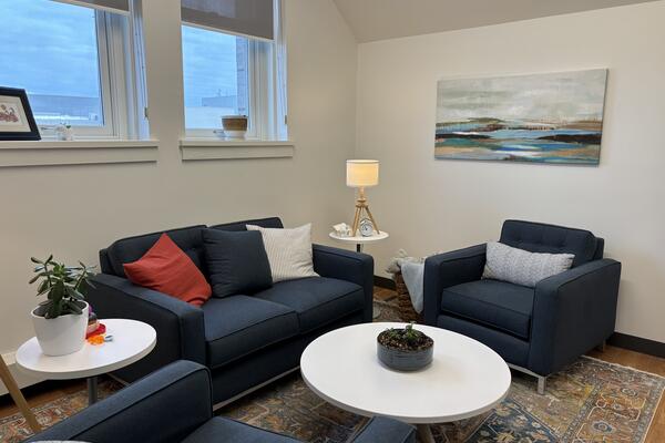 Image of interview room with blue couches and chairs