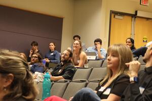 Student asking questions to the presenter at the First Annual CEC-REN Symposium