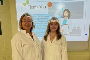 Rachel & teacher at front of class