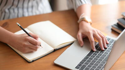 person studying with a laptop