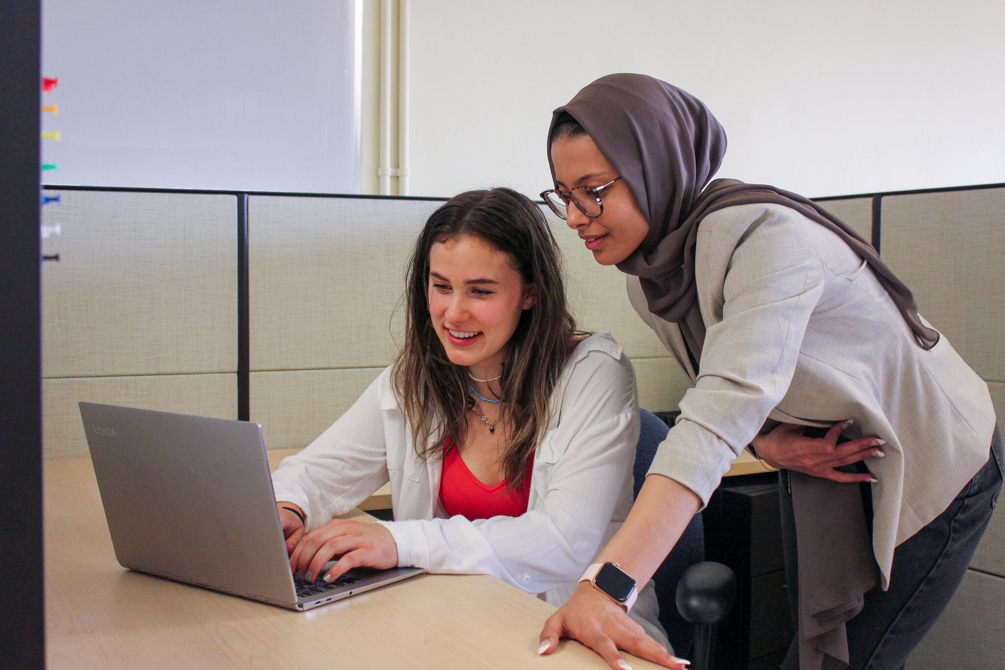 students looking at a laptop