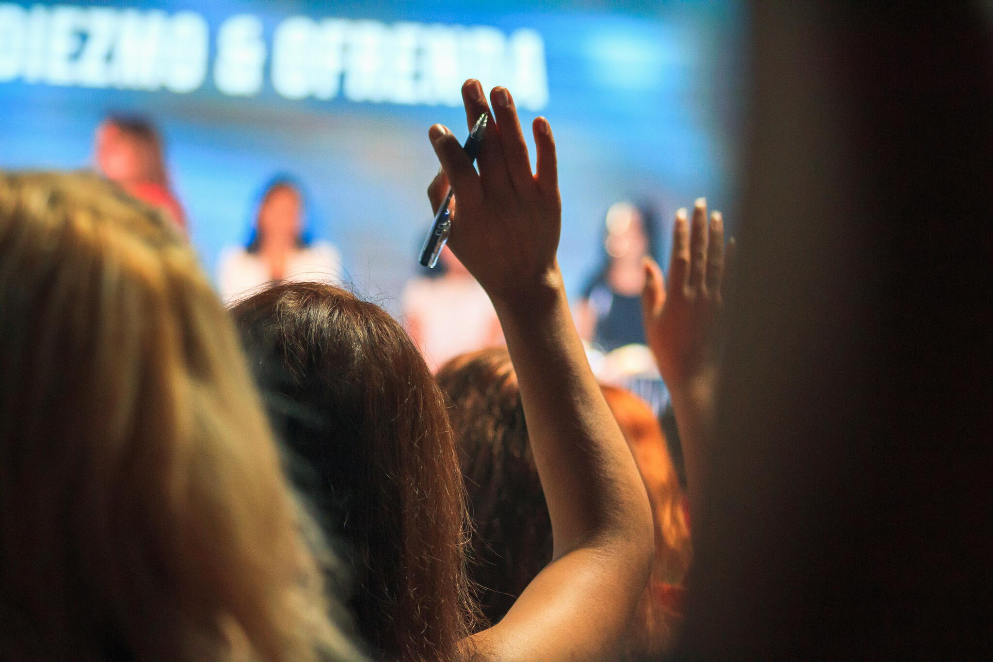 students raising their hands