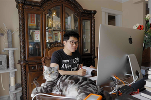 Roy Zheng working at his computer