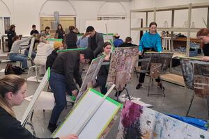 Students working with charcoal