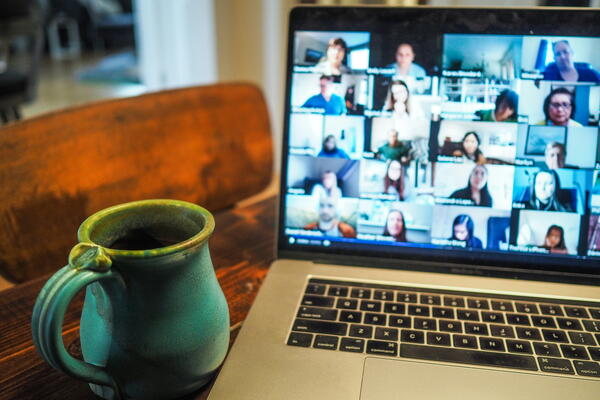 A laptop with a Zoom meeting on the screen