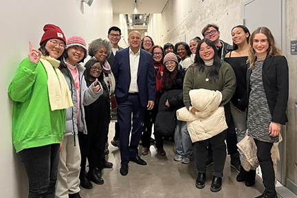 Students taking photo backstage with Hilario Duran at the Isabel Bader Centre 