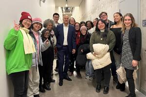 Students taking photo backstage with Hilario Duran at the Isabel Bader Centre 