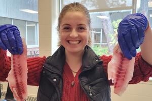 Student filleting fish