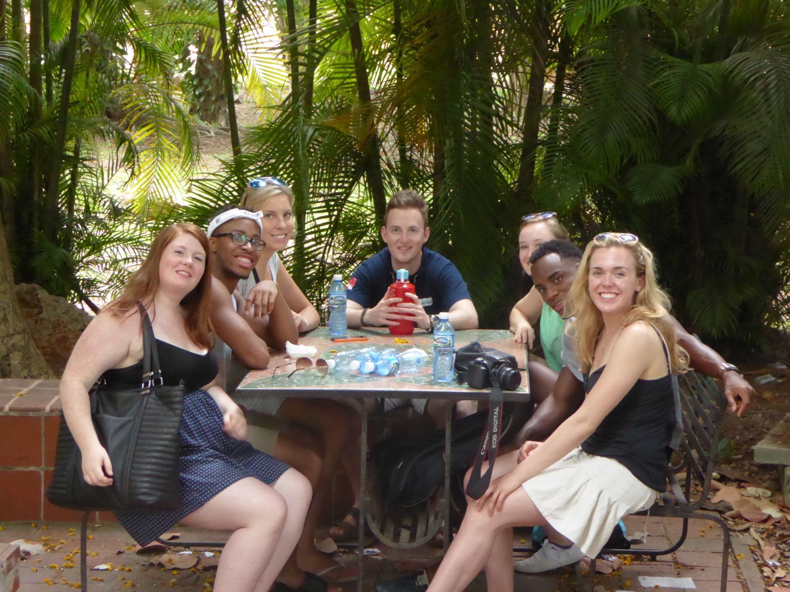 Students sitting at a picnic table in Havana