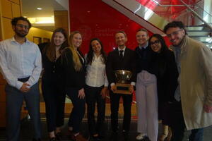 Prof Weinberg and students with Negotiations Cup