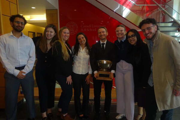 Prof Weinberg and students with Negotiations Cup