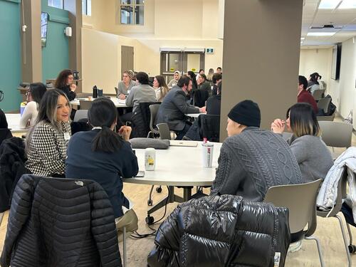 MIR students speaking with alum