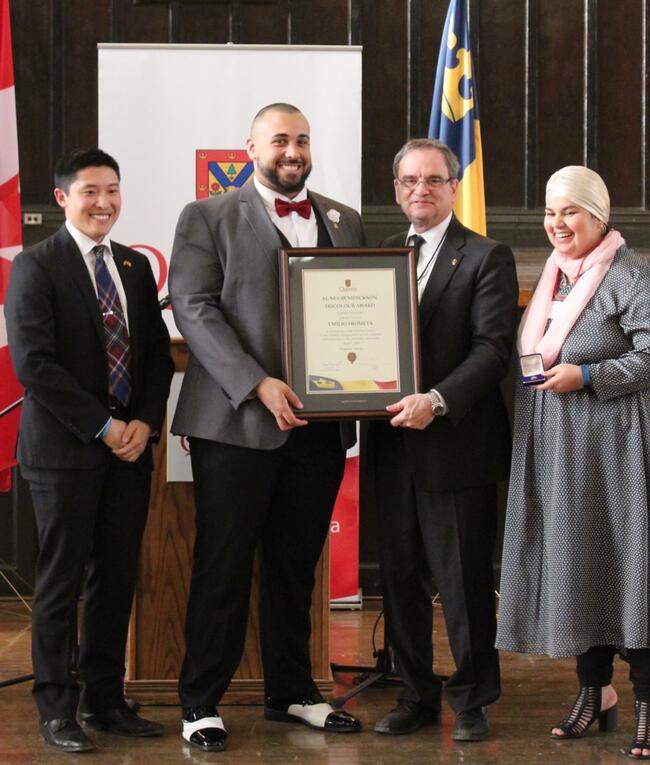 Emilio recieving award