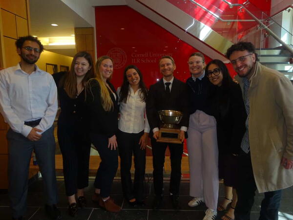 Prof. Weinberg and MIR students with Negotiations Cup